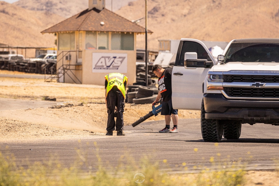 Course workers and recovery vehicles at an off-road motorsport venue