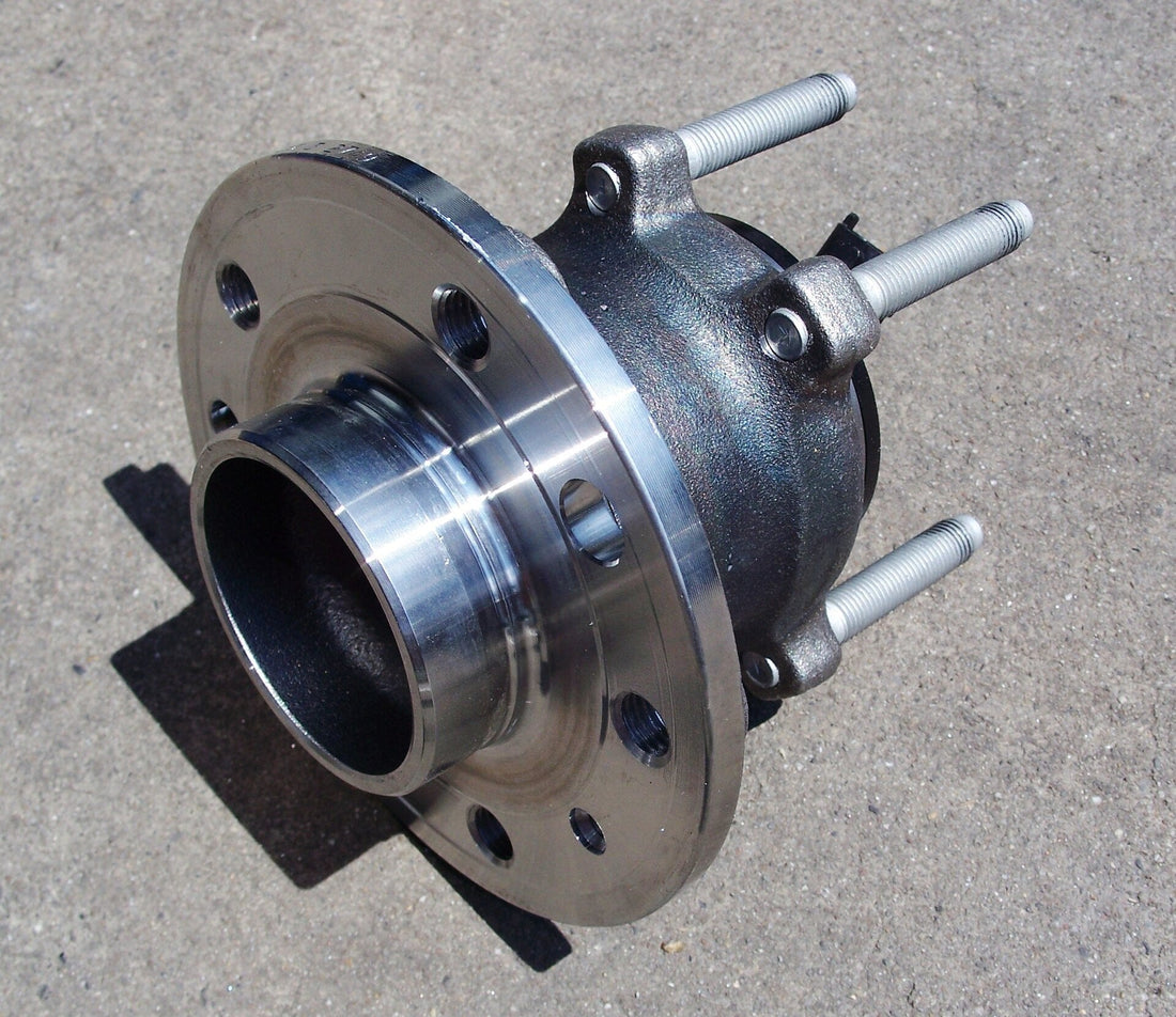 Automobile wheel hub assembly; representative component image for track-car wheel-bearing inspection. Photo by Cschirp / Wikimedia Commons, CC BY 3.0.