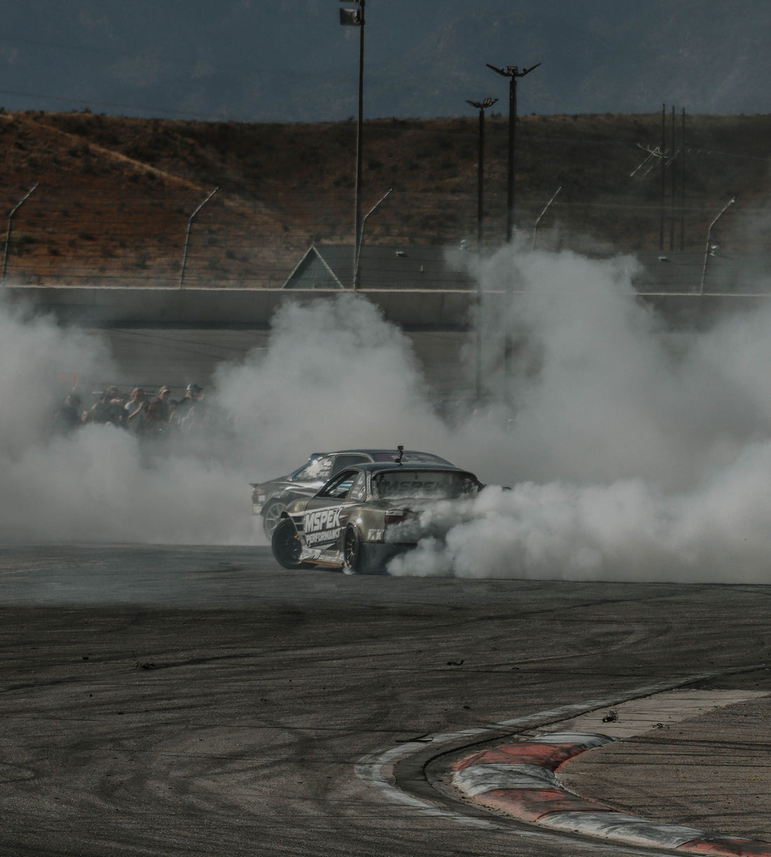 Two cars drifting through tire smoke; representative photograph by Jacob Moore, not the September 2026 Formula DRIFT Las Vegas event.