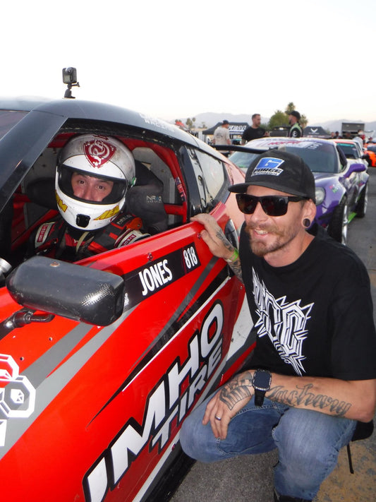 Jeff Jones in his drift car talking with Tim Keehnel in the Hotpit AutoFest staging line