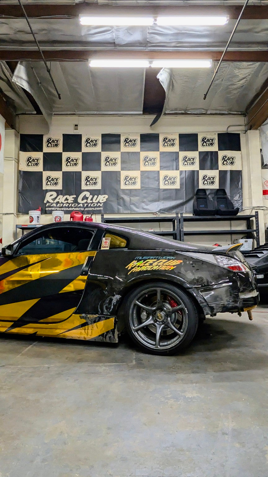 Black and gold Nissan 350Z project featuring Musa Artwork graphics at Race Club