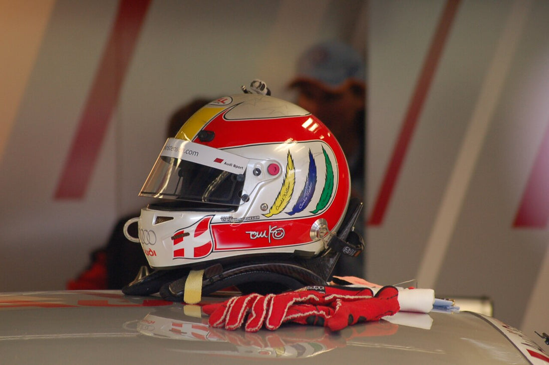 Tom Kristensen’s helmet, head restraint and red racing gloves resting on a car at Oschersleben in 2008.
