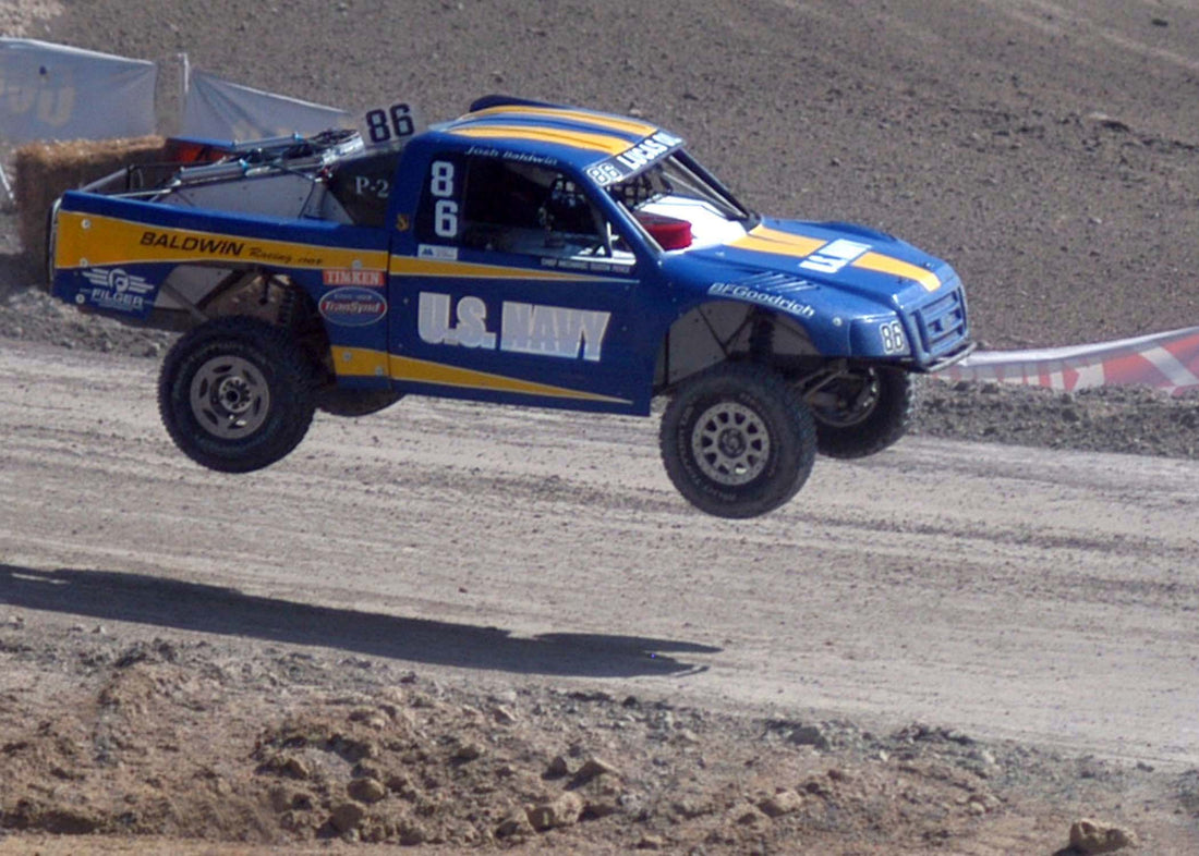 Representative archive: Pro 2 short-course off-road race truck jumping during Championship Off-Road Racing competition