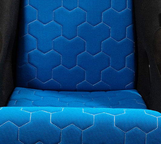 NRG SC-300-GS02BL blue three-piece FRP bucket seat cushion set with white-stitched hex geometric pattern