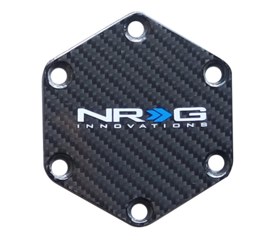NRG STR-630CF aluminum horn-button delete plate with carbon-fiber background; manufacturer catalog photo
