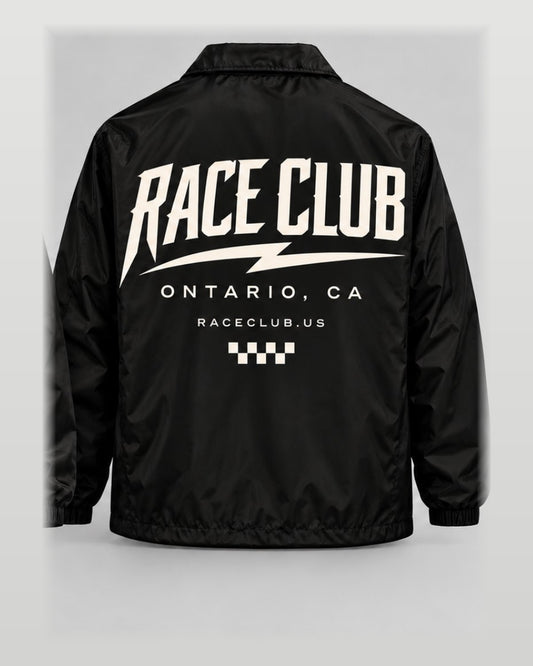 Rear view of Race Club black coach jacket showing oversized cream Race Club Ontario CA graphic
